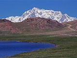 04 Nanga Parbat Rupal Face Above Sheosar Lake On The Deosai Plains We came over a hill and there in front of Sheosar Lake on the Deosai Plains was the Rupal face of Nanga Parbat. The mountain stands alone on the horizon, shining brilliantly white in the sunshine.
